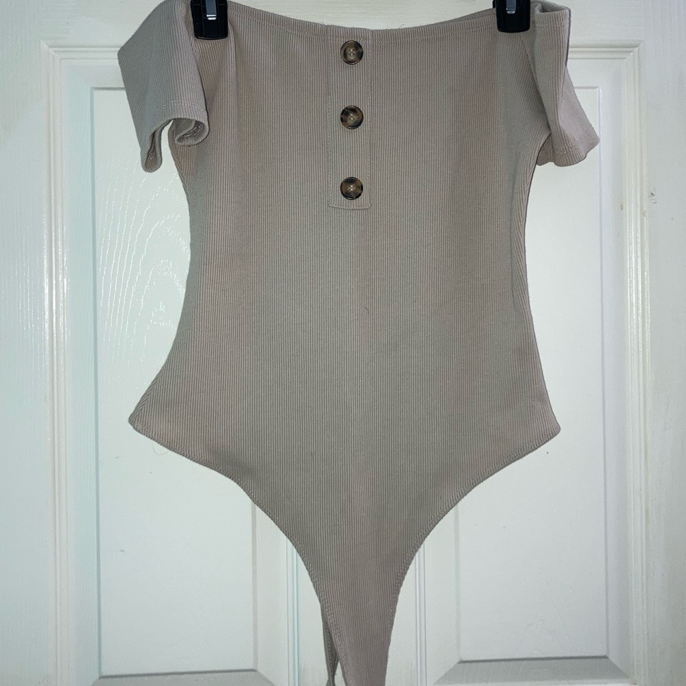 tan colored body suit